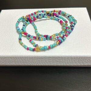 Multicolored waist beads. About 32 inches. Stretchy. Brand new.